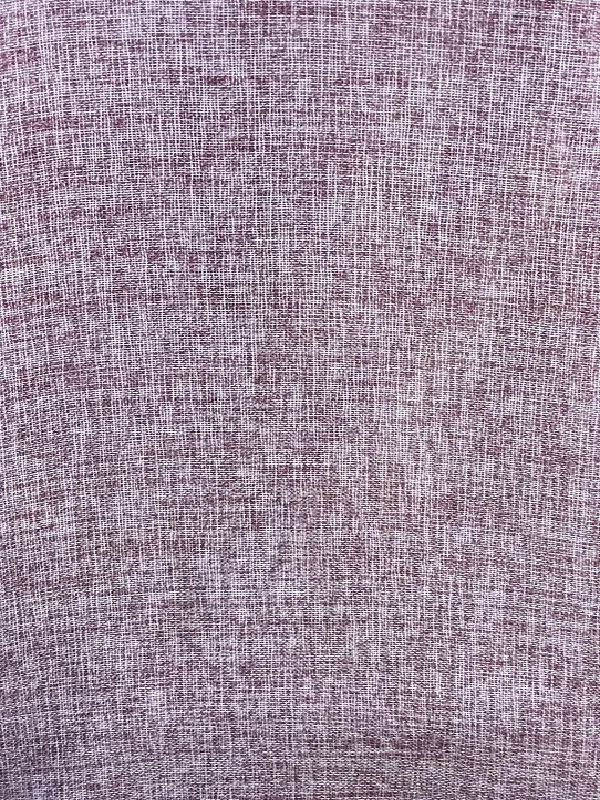 A close-up of textured linen curtain fabric in muted plum, softly draped to reveal organic weave and natural drape, evoking quiet elegance and timeless warmth.