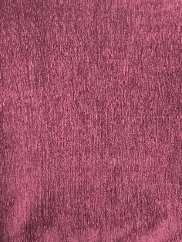 Velvet Twilight curtain fabric swaying gently in soft light, rich plum hues deepening with shadow, luxurious texture catching ambient glow in a serene living room setting.