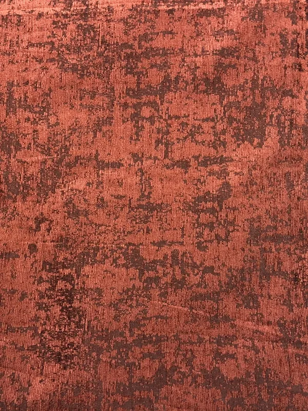 Luxurious crimson velvet curtain with Venetian plaster texture, draped elegantly in a sunlit room, casting soft shadows and highlighting rich architectural details.