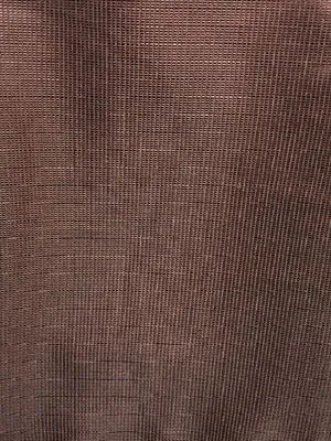 Luxurious velvet-textured linen blackout curtains in warm tones, softly draped to create a cocoon of darkness, ideal for serene bedrooms and cozy living spaces.