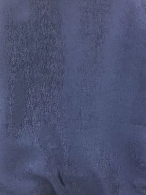 Midnight velvet taffeta drapes with structured folds, hanging elegantly in a sophisticated living room, soft ambient light filtering through the rich fabric, enhancing the luxurious atmosphere.